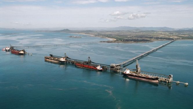 Coal ships line up off the Queensland coast as Aurizon dispute with miners worsens